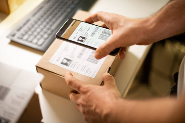 istock Delivery service, scanning a shipping label 1190618050