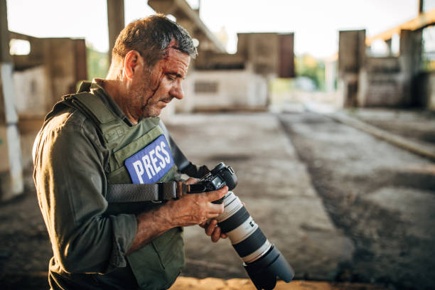 istock War photographer in abandoned building 1190622726