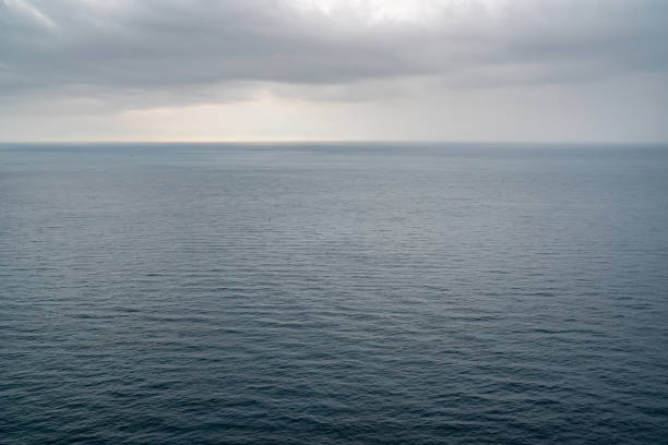 istock Blue sea surface with small waves in cloudy day. 1190622872