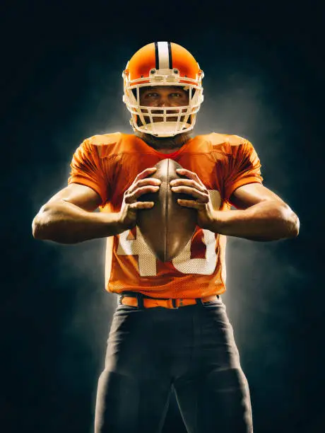 American football player in action on a professional stadium