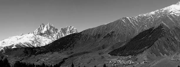 istock Mountain landscape panorama. Majestic mountain peaks covered with snow. 1190626112