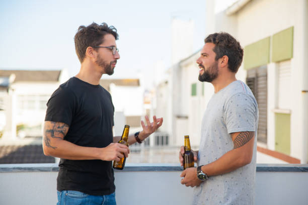 istock Two male friends excited with discussion 1190628248