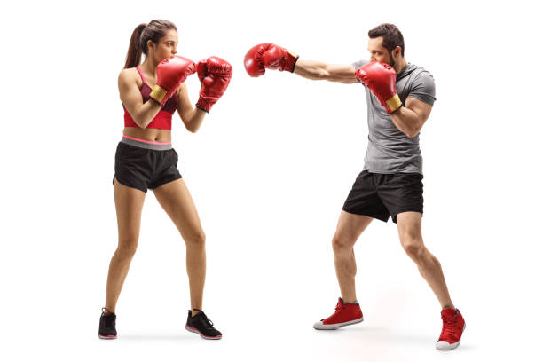 istock Young female and a young male training box 1190628287