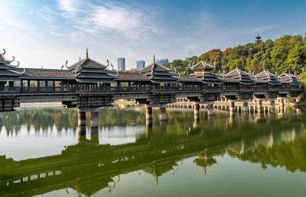 Ancient style bridge over a lake Nice ancient style bridge at heroes park, Changsha, China. hunan province photos stock pictures, royalty-free photos & images