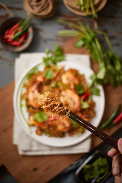 istock Tong the noodle by chopsticks, Selective focus 1190630512