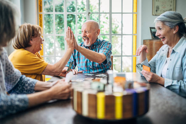 istock People playing cards in nursery home 1190632290