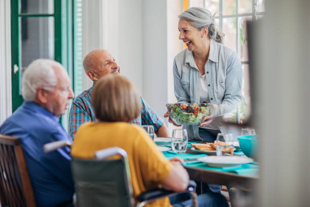 istock Senior friends having lunch together 1190634045