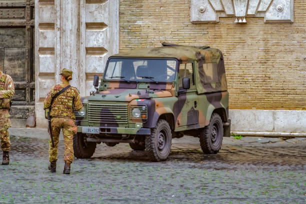 Esercito Italian Army land defense force vehicle as a part of 'Operation Safe Streets' L'operazione Strade Sicure. Rome, Italy - November 20 2019: Army vehicle with military personnel at tourist site. roman army stock pictures, royalty-free photos & images