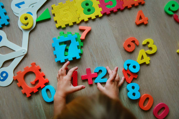 istock little girl learning numbers and math, education concept 1190637299