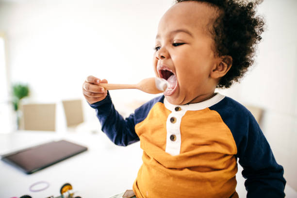 istock Toddler eating yogurt 1190638841