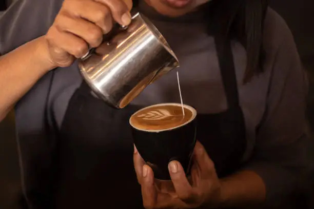 Photo of barista making cappuccino