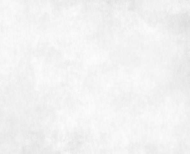 istock Ancient parchment paper with worn white background 1190640304