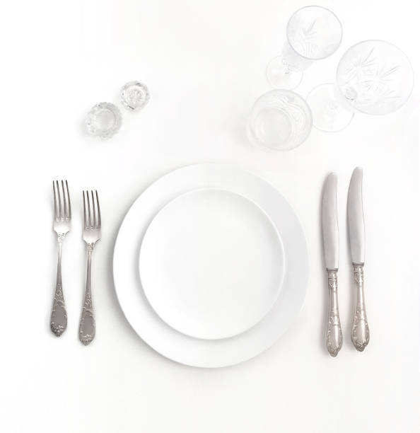 istock New luxury white ceramic plate, silver vintage cutlery view from above on a isolated background. Top view.
Knife and fork for a festive table for a wedding, birthday or party. 1190640363