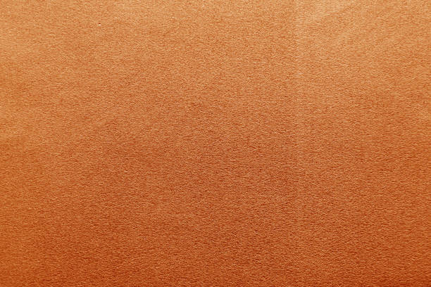 istock Plastic glittering texture in orange color. 1190640400