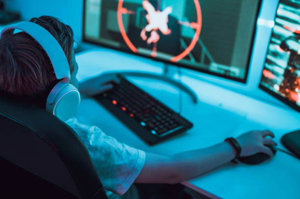 istock Boy enjoys video game entertainment on computer screen 1190641232