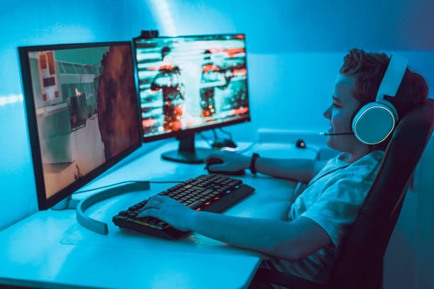 istock Playing esport game on computer at home at night 1190641261