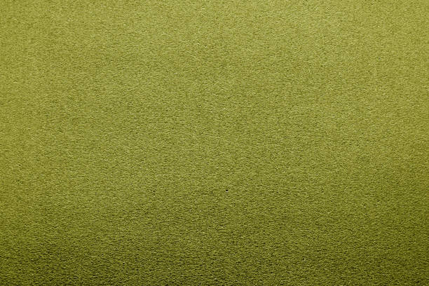 istock Plastic glittering texture with blur effect in yellow color. 1190641402