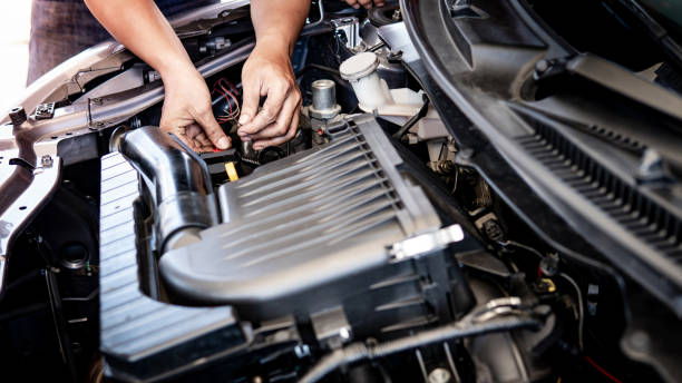 istock Auto mechanic hand fixing car engine in the garage 1190641703