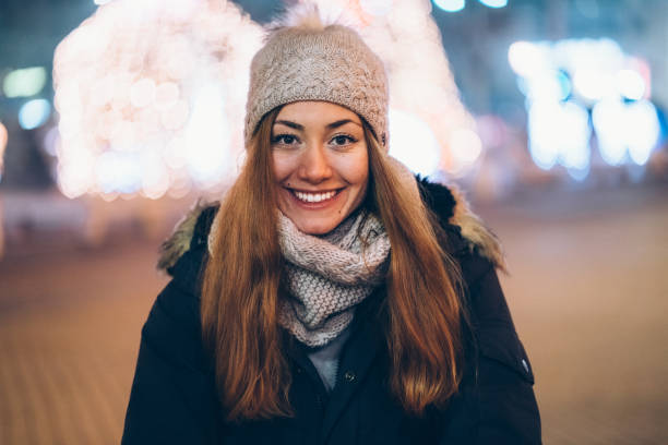 Happy woman at New Year smiling to the camera