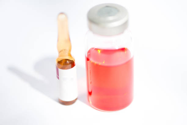 The vaccine in the vial illuminated with light