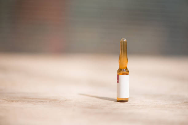 istock Injection ampule show medicine background 1190644596