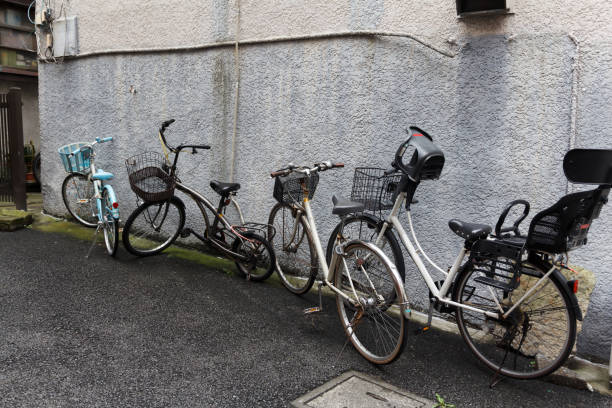 istock Old bicycles against a house exterior wall. 1190644889