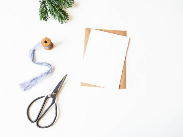 istock Paper card for letter, envelope and xmas decoration on white background. Top view. Copy space 1190645868