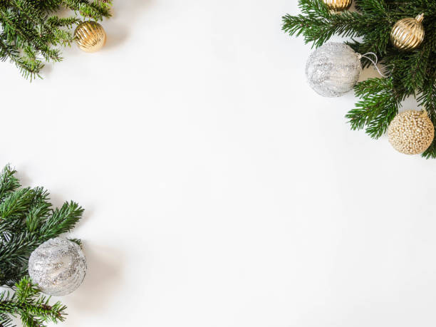 istock Flat lay creative Christmas frame with fir branches and Christmas balls on white background. Top view. 1190645924