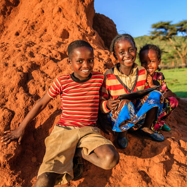 istock Little African children using digital tablet, East Africa 1190649886