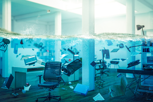 interior of an office completely flooded, objects floating in water and selective focus on a chair. 3d image render. concept of problems at work.