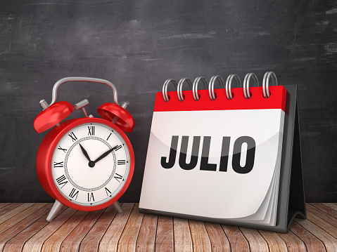JULIO Calendar with Alarm Clock on Chalkboard Background - 3D Rendering