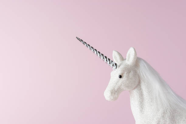 istock Creative composition with glitter unicorn on pink background. Minimal holiday concept. 1190652456
