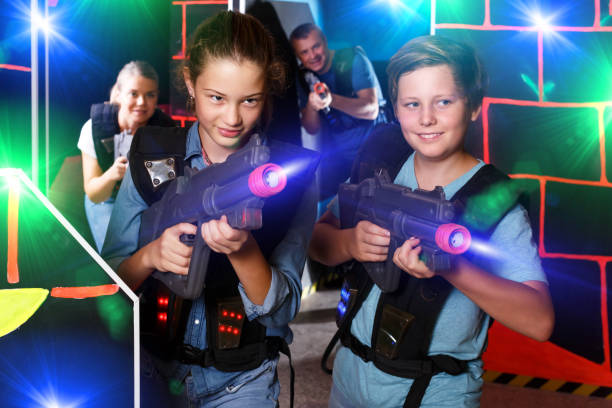 istock Teenage kids playing lasertag 1190654767