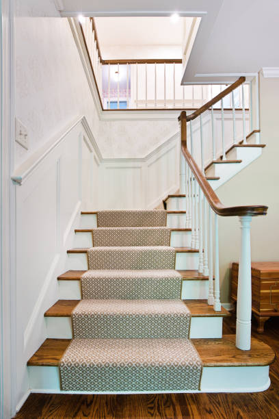 Architecture Interior Stairwell of a Residential Home Showcase interior design of a first floor staircase and stairwell of a luxury home. the hamptons photos stock pictures, royalty-free photos & images