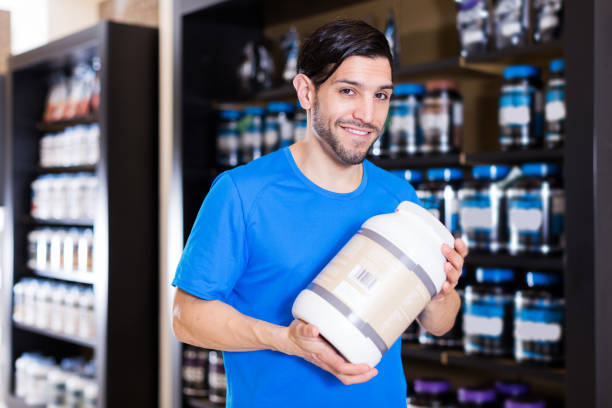 istock sport man looking different sport nutrition products 1190655996