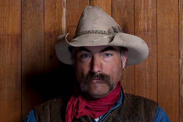 istock Cowboy By a Wood Wall 119065730