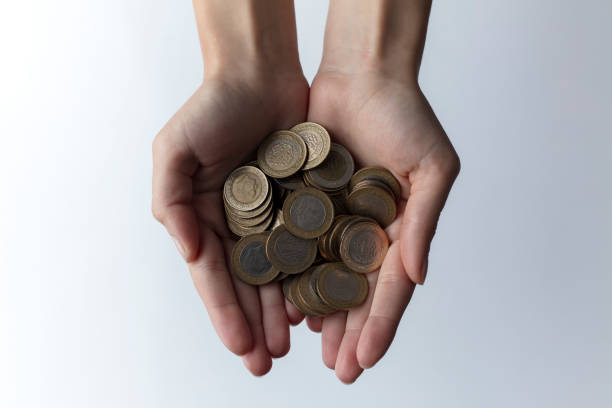 istock hands full of money 1190658733