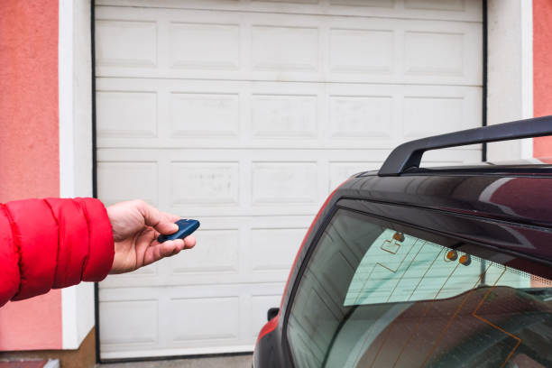 istock Hand use remote controller for closing and opening garage door 1190658947