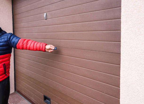 istock Hand use remote controller for closing and opening garage door 1190658957
