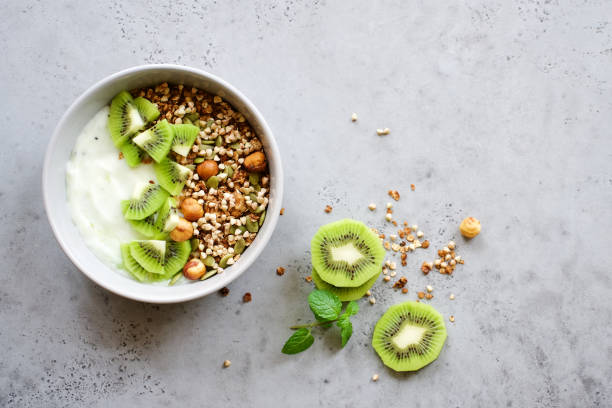 Buckwheat granola with yogurt and kiwi stock photo