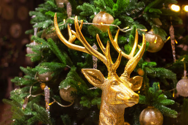 istock big deer in gold figurine christmas tree decor. interrior noel disign 1190661432