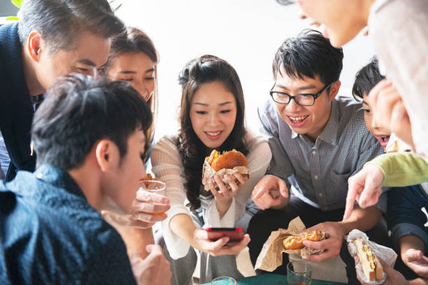 istock Team having lunch together and using smartphone 1190663166