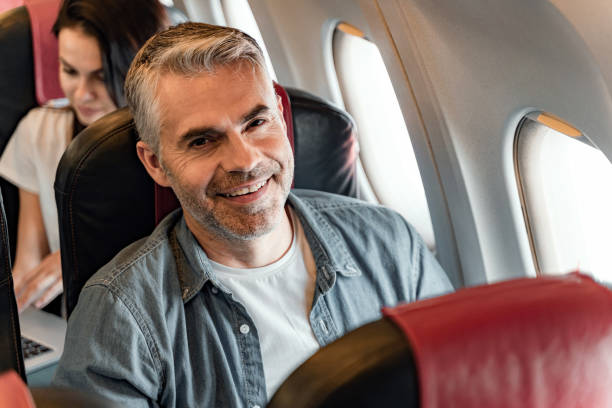 istock Happy man is sitting near window in cabin 1190663555