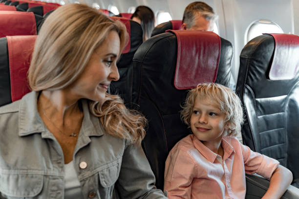 istock Smiling mother is looking at her son in cabin 1190663557