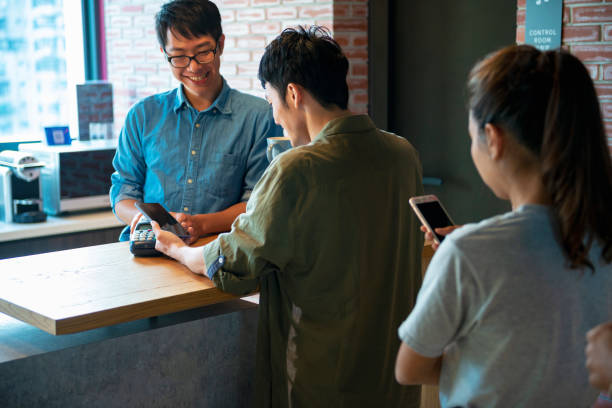 istock placing smartphone on credit card payment machine 1190664372