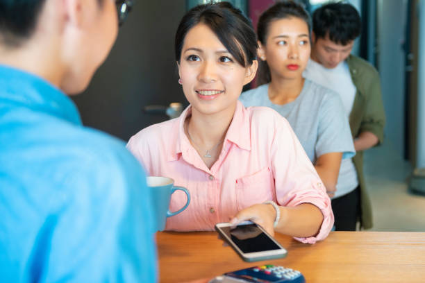 istock placing smartphone on credit card payment machine 1190664389