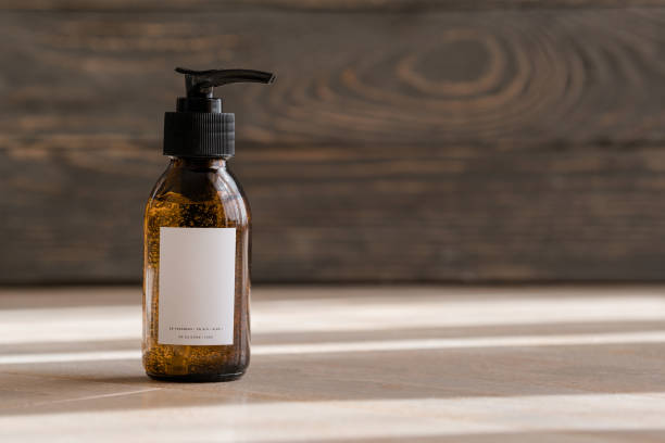 Cosmetic dark amber bottles on wooden  table