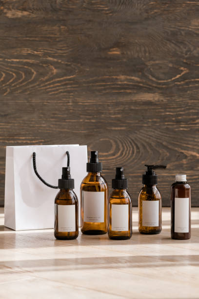 istock Cosmetic dark amber bottles on wooden  table 1190665209