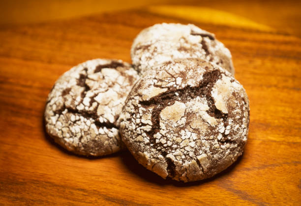 istock Cracked Chocolate Cookies On A Wooden Surface 1190665806
