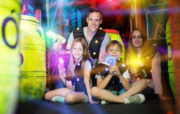 istock Famiy with laser pistols in beams 1190669844